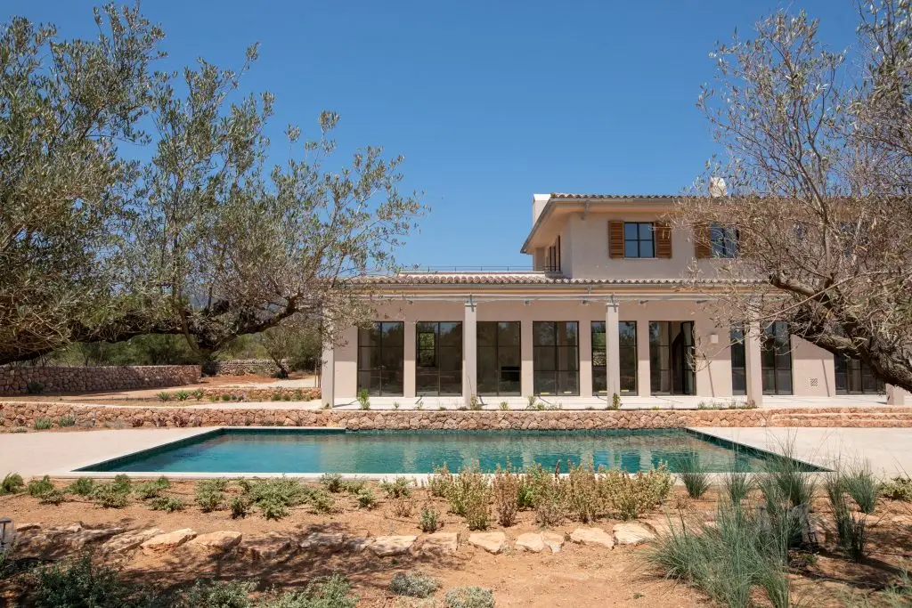 Finca and pool framed by olive trees in Santa Maria del Camí