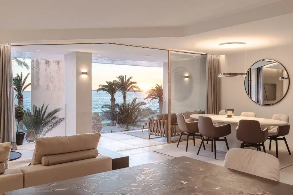Living and dining area opening to the terrace at the Portixol duplex