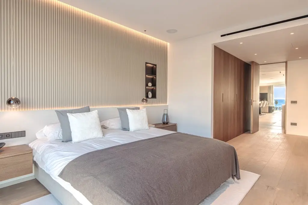 Bedroom with integrated wood wardrobes at the Portixol duplex