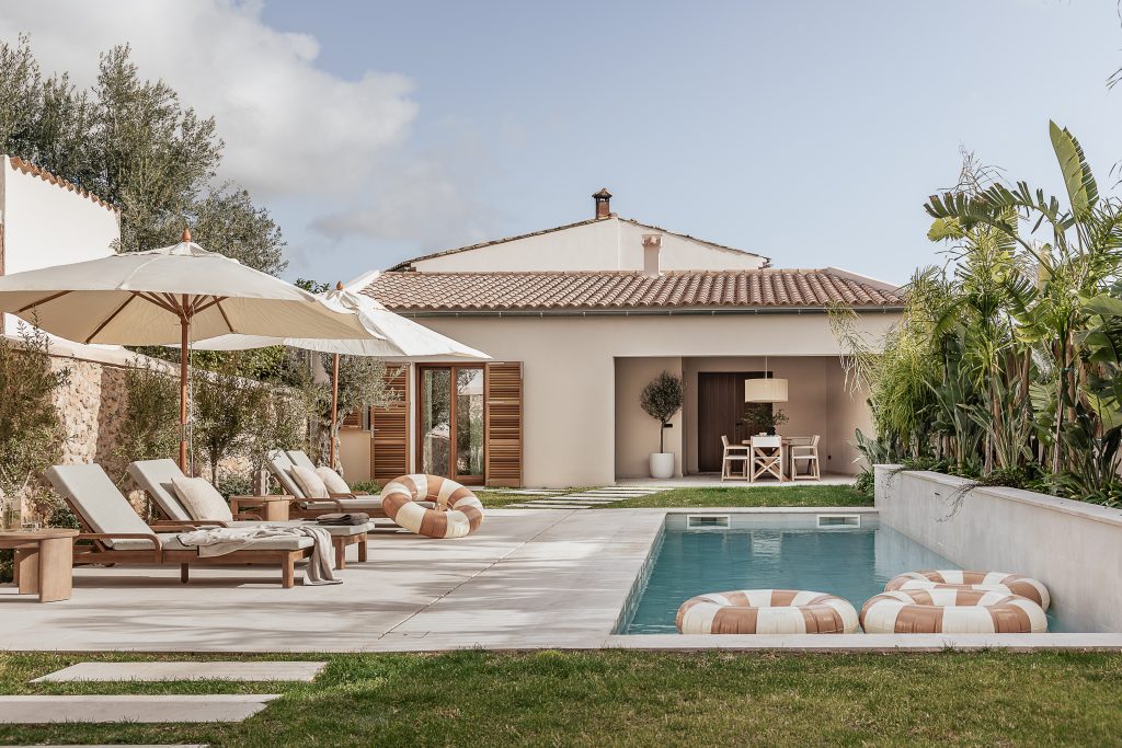 Pool and garden with the guest house beyond at the Lloseta townhouse