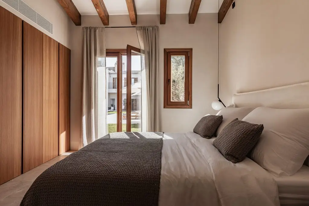 Guest bedroom opening to the garden at the Lloseta townhouse